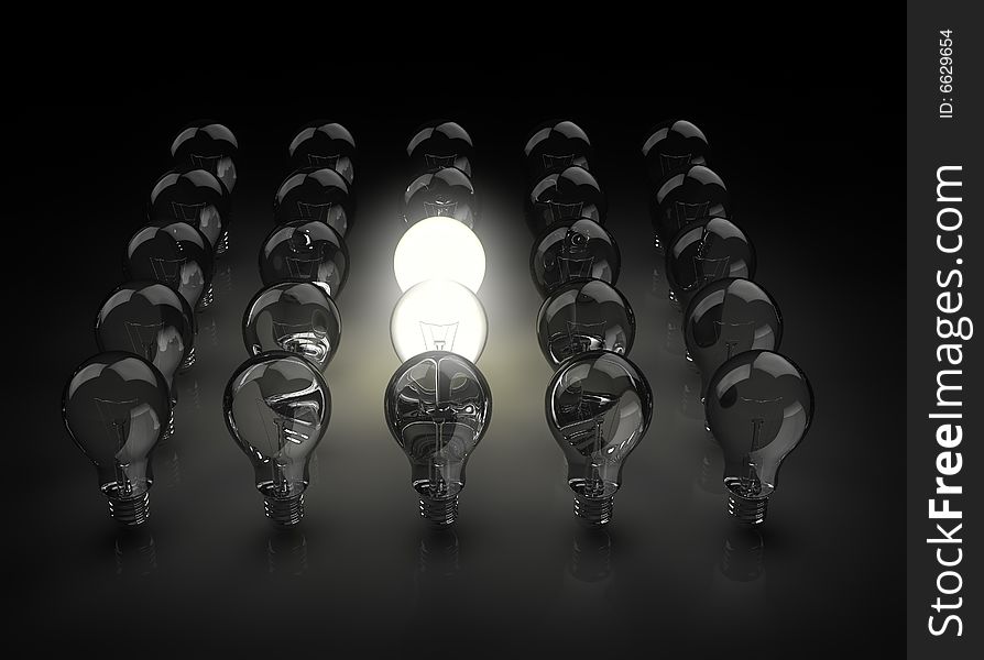 Group of light bulbs with one shining