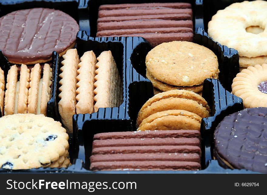 A shot of an assortment of biscuits in a carton. A shot of an assortment of biscuits in a carton