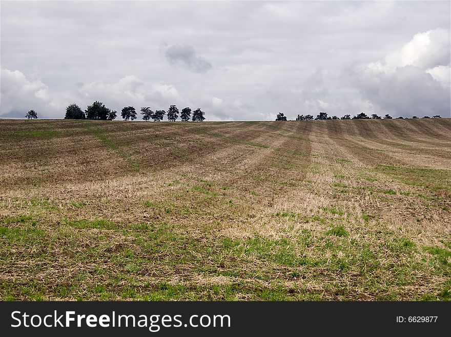 Agriculture Landscape in Fall and rainy clouds