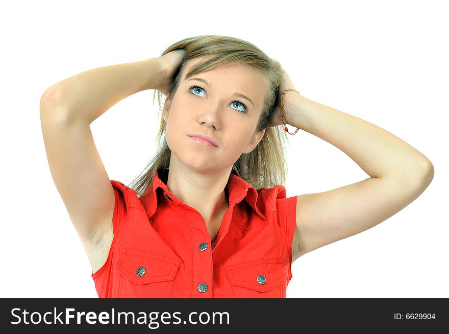 Pretty young girl corrects hairstyle, isolated on white