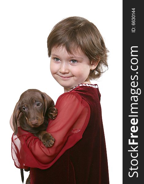 Little girl with dachshund puppy