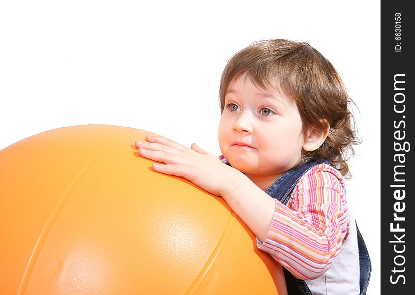 Little Girl Playing With Big Orange Ball