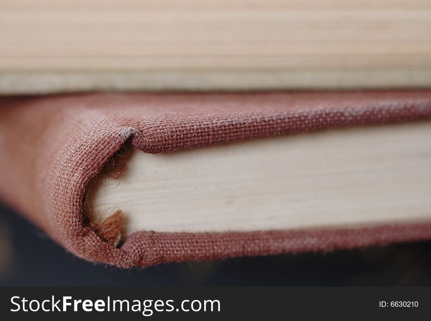 Big pile of old books. Close-up. Narrow depth of field.