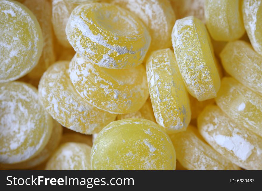 Sweet yellow candies - color background. Sweet yellow candies - color background