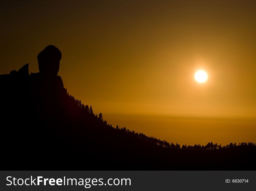 Orange sunset with mountain and pine forest. Orange sunset with mountain and pine forest