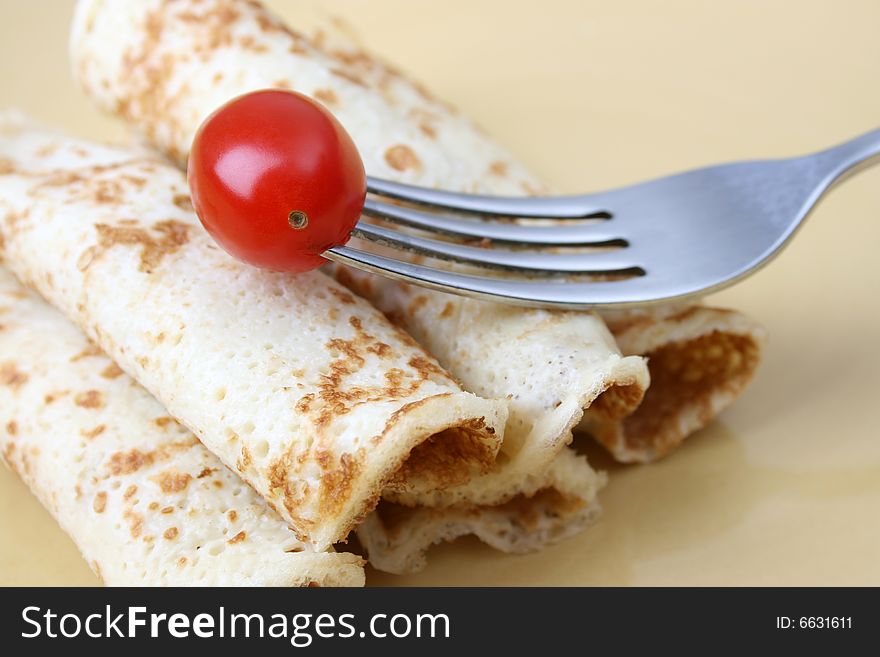 Close up of pancakes on a yellow plate. Close up of pancakes on a yellow plate