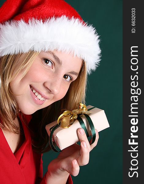 Beautiful teenager wearing a red shirt and christmas hat. Beautiful teenager wearing a red shirt and christmas hat