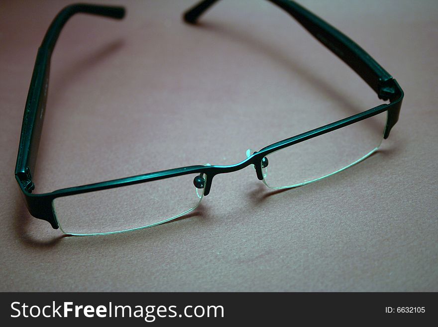 Pair of spectacles o gray background