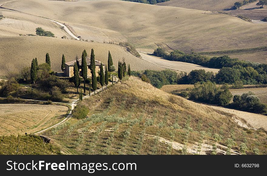 Tuscan landscape Valle d'Orcia, italy, isolated farm with cypress and hills. Tuscan landscape Valle d'Orcia, italy, isolated farm with cypress and hills