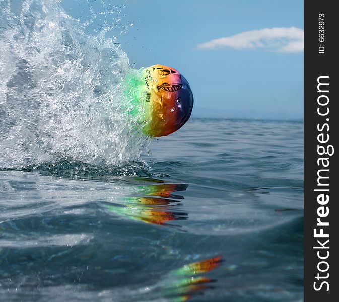 A ball flying in the water surface. A ball flying in the water surface