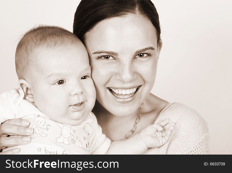 Smiling Mother and Baby on a white background. Smiling Mother and Baby on a white background