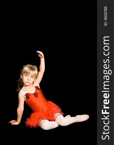 Young ballet dancer wearing a red costume. Young ballet dancer wearing a red costume
