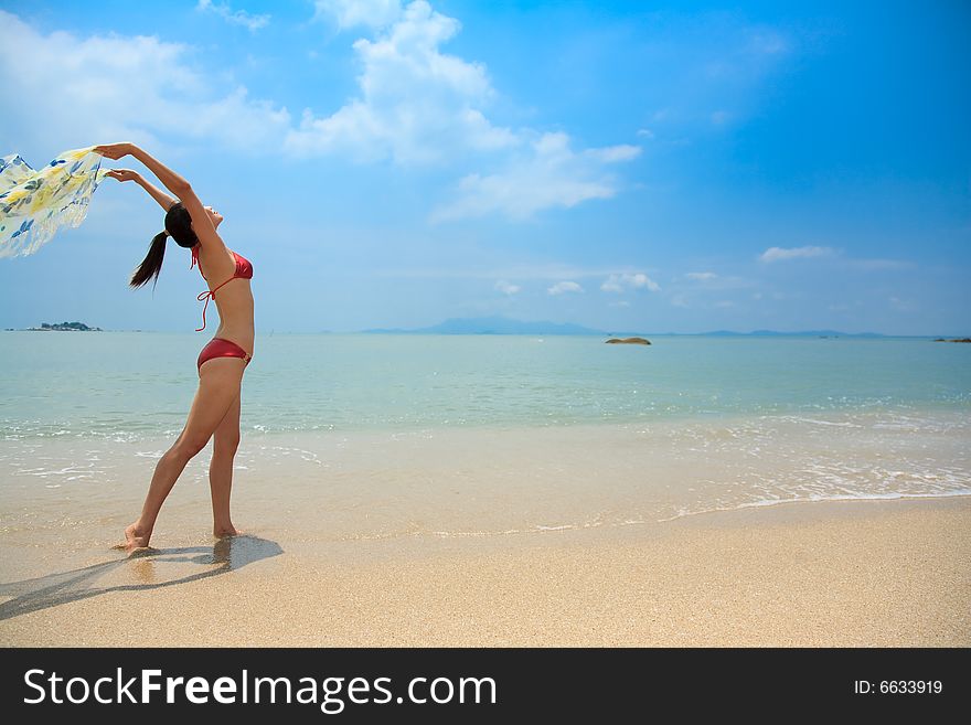 Asian young woman enjoy sea breeze at the beach. Asian young woman enjoy sea breeze at the beach