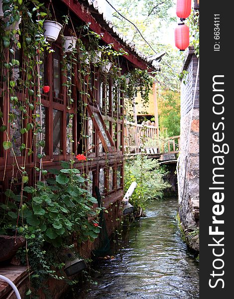 The Old Town of Lijiang is also known as Dayan Town in Lijiangba. Ancient building in Lijiang along side stream . The Old Town of Lijiang is also known as Dayan Town in Lijiangba. Ancient building in Lijiang along side stream .