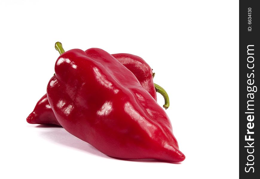 Fresh red peppers close-up on a white background. Fresh red peppers close-up on a white background