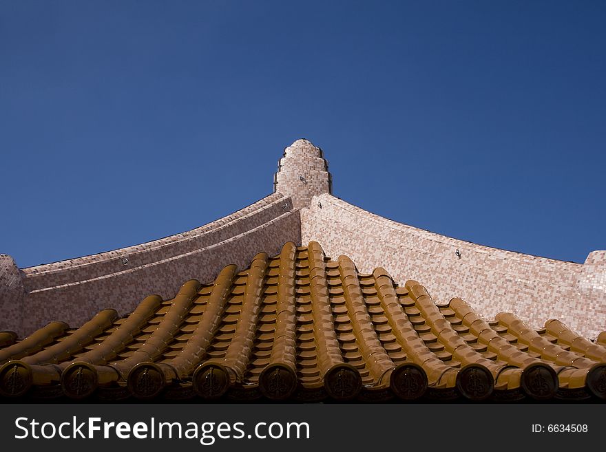 Chinese roof top with blue sky.