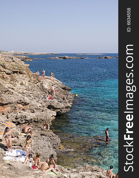 People jumping off cliffs and boat to swim. People jumping off cliffs and boat to swim