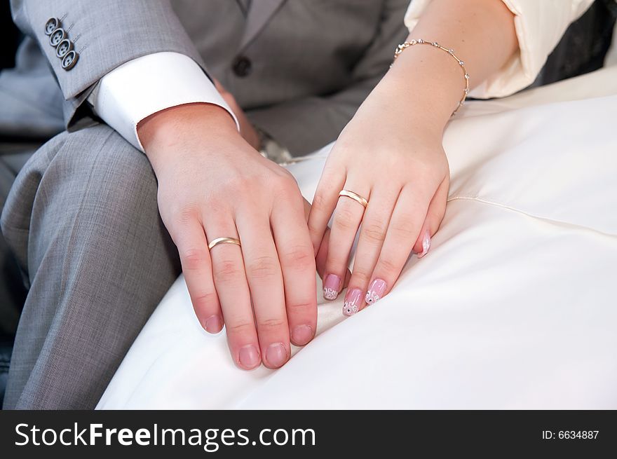 Hands and rings of just married couple