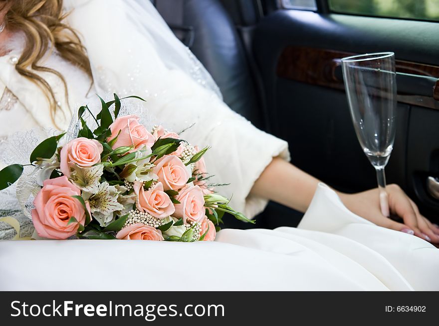 Hands and flowers of the bride