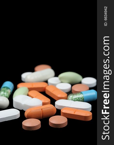 Several pills on black background. Several pills on black background