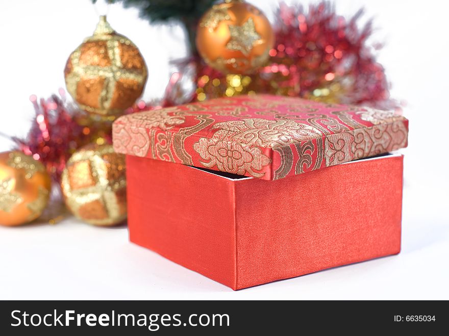 Present box under the Christmas tree isolated on a white background. Present box under the Christmas tree isolated on a white background.