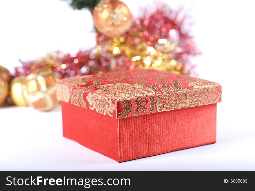 Present box under the Christmas tree isolated on a white background. Present box under the Christmas tree isolated on a white background.