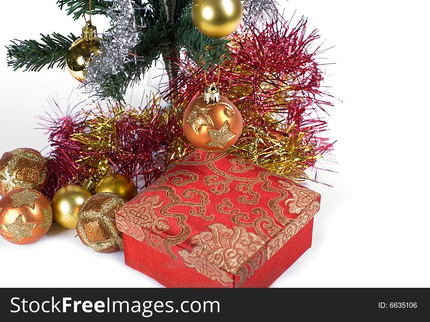 Present box under the Christmas tree isolated on a white background. Present box under the Christmas tree isolated on a white background.