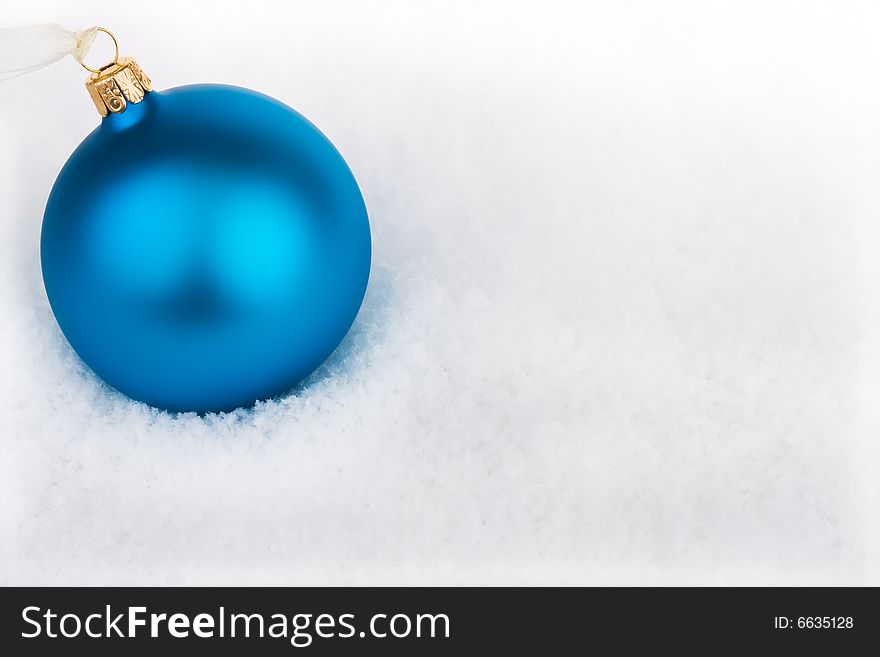 Cool blue Christmas baubles in the snow