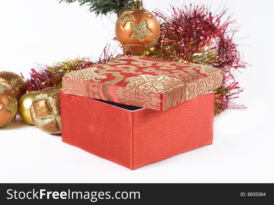 Present box under the Christmas tree isolated on a white background. Present box under the Christmas tree isolated on a white background.