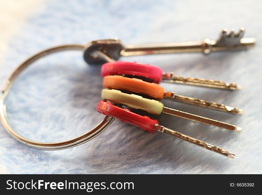 A bunch of colour coded keys on a keyring. A bunch of colour coded keys on a keyring