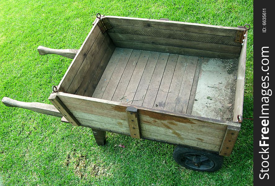 Antique farm wagon in a hayfield on a summer day. Antique farm wagon in a hayfield on a summer day