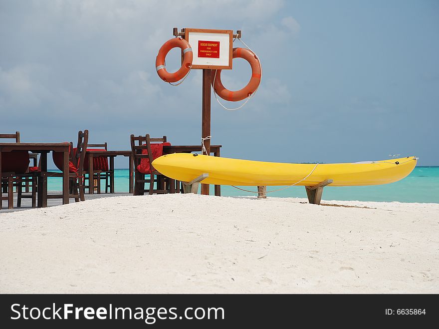 A kayak on the beach of a Maldivian resort.