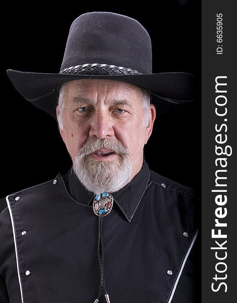 Handsome olld baby-boomer Cowboy dressed in black and looking like Buffalo Bill Cody. Handsome olld baby-boomer Cowboy dressed in black and looking like Buffalo Bill Cody