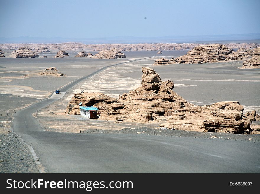 Yadan landforms- The world Geologic Garden on the Desert which is the lmmense in Scale. the most perfect in their shapes and the richest in intension in the world.
 gobi desert  road Dunhuang gansu china