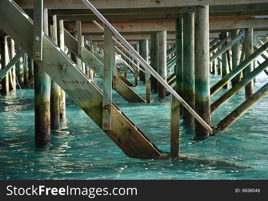 Shot of underneath the luxury 'over the water' villas of one of the Maldive Islands. Shot of underneath the luxury 'over the water' villas of one of the Maldive Islands.