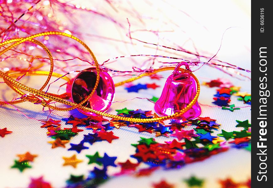 Christmas hand bells with a tinsel and shine