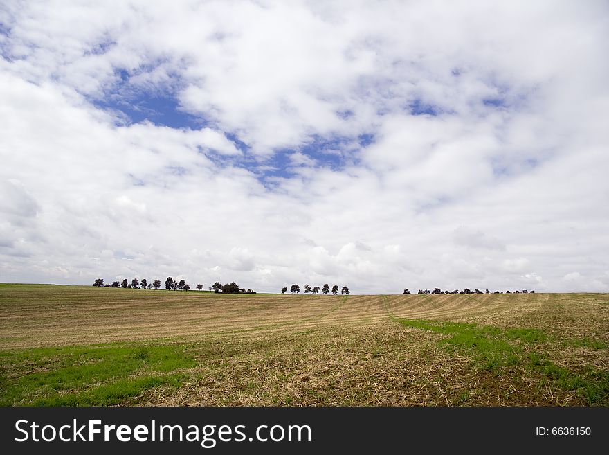 Agriculture Landscape in Fall and rainy clouds