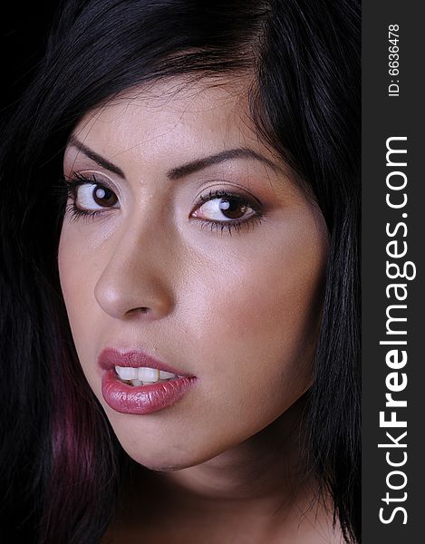 Beautiful hispanic young woman in closeup