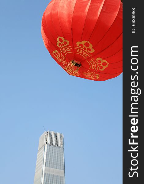 Red lantern and  skyscraper with blue sky in Beijing CBD(Central Business District),China. tradition   VS modern. Red lantern and  skyscraper with blue sky in Beijing CBD(Central Business District),China. tradition   VS modern