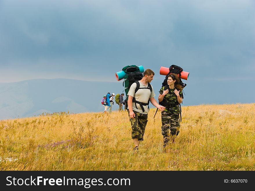 Backpackers hike in Crimea mountains. Backpackers hike in Crimea mountains