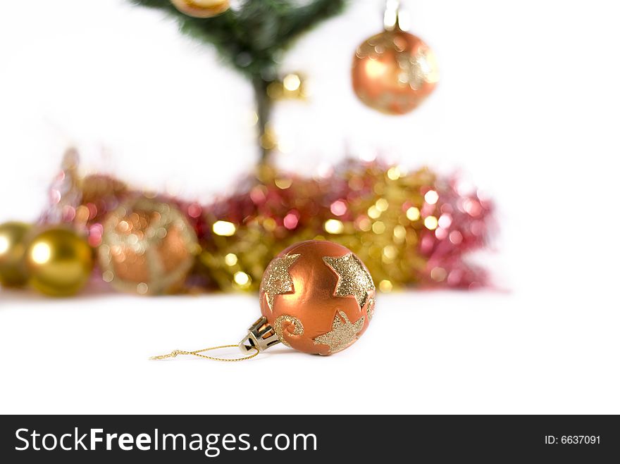 Christmas decoration isolated on a white background. Golden shiny ball.