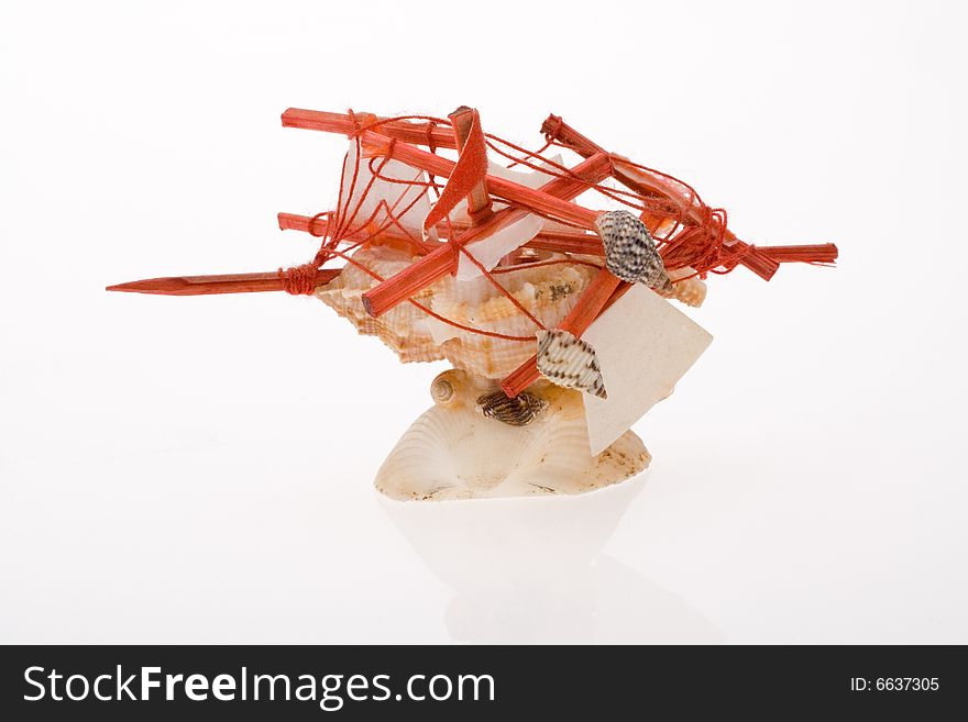 Destroyed toy sailboat on white background. Destroyed toy sailboat on white background