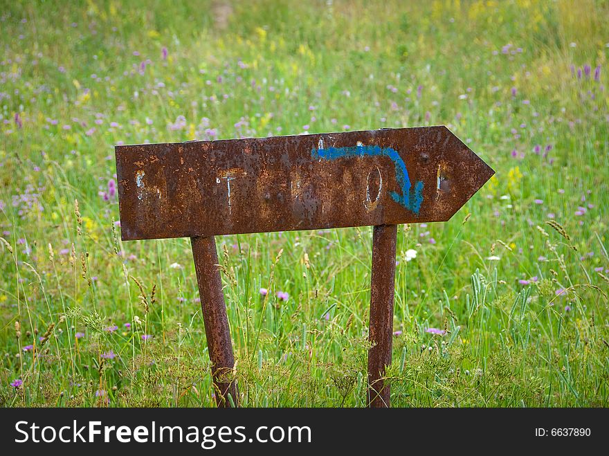 Rusty direction sign on a nature. You can write your text on it. Rusty direction sign on a nature. You can write your text on it.