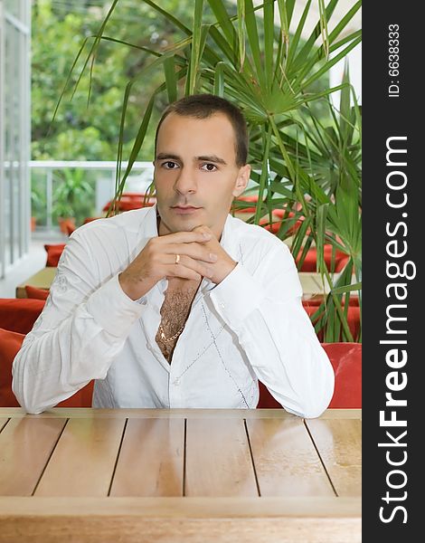 Young man in cafe for your design