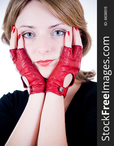 Portrait of a young girl in red gloves
