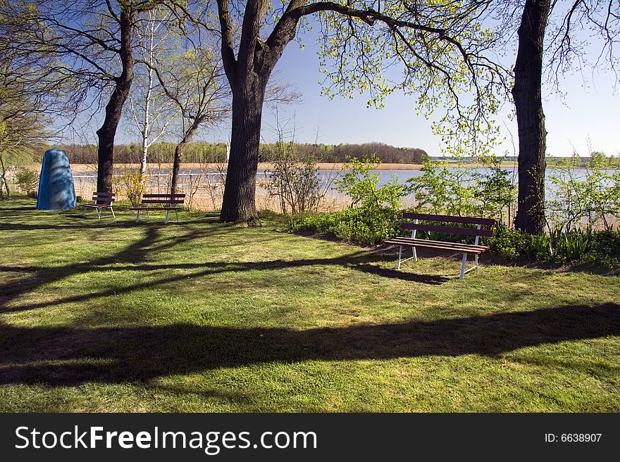 Lake Neumuehlenteich in Springtime - in front nice tree shadows