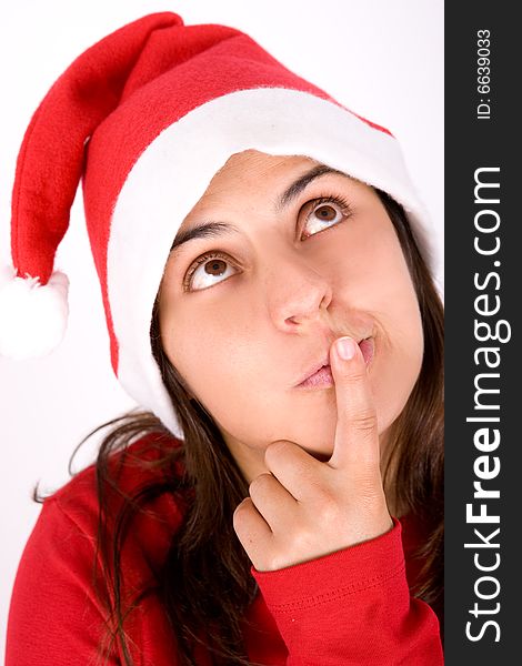 Beautiful young woman with red christmas hat