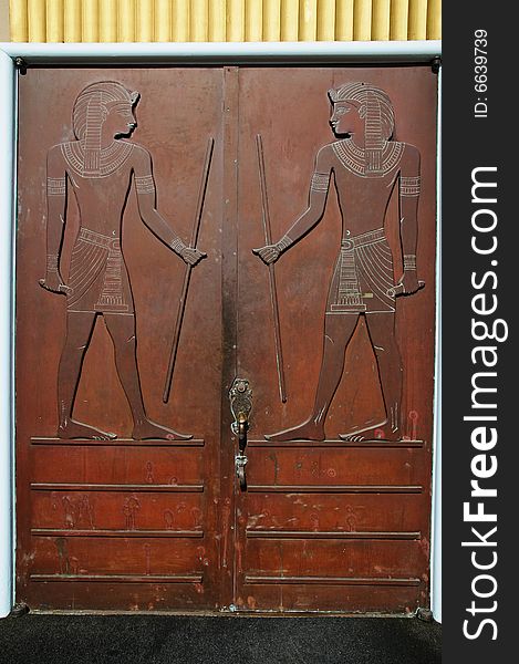 Crafty woden door with replica of ancient egyptian relief