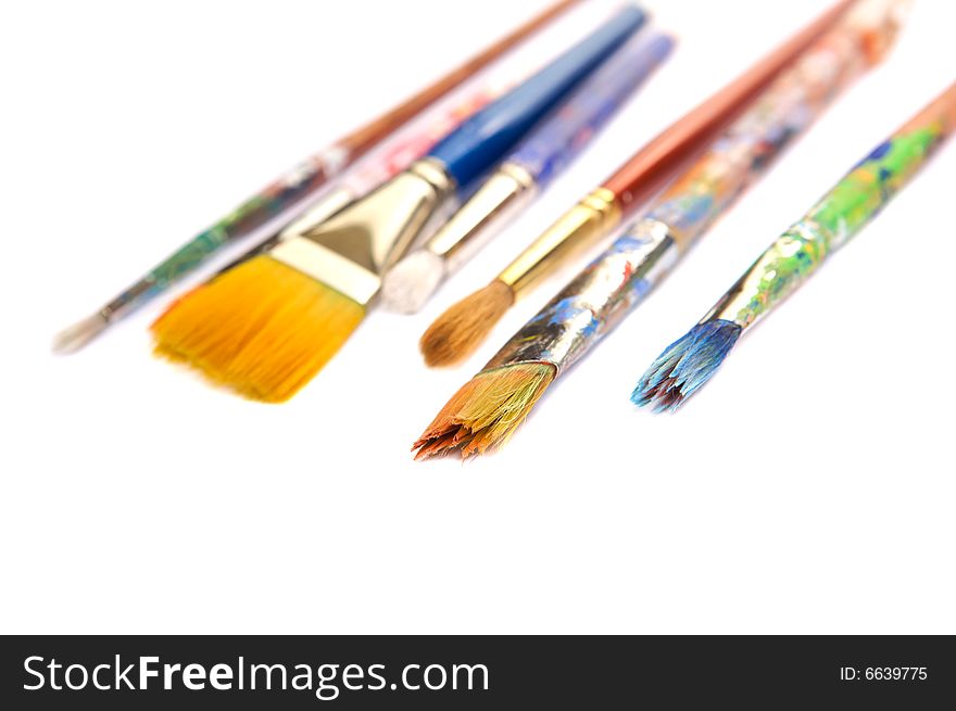 Colorful paint brushes on a white background. Colorful paint brushes on a white background