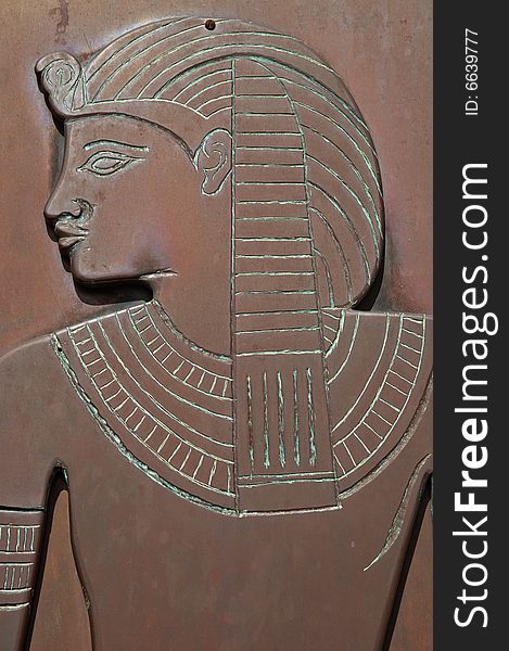 Crafty woden door with replica of ancient egyptian relief - closeup details